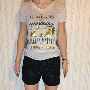 Black sparkly polyester shorts, white tee